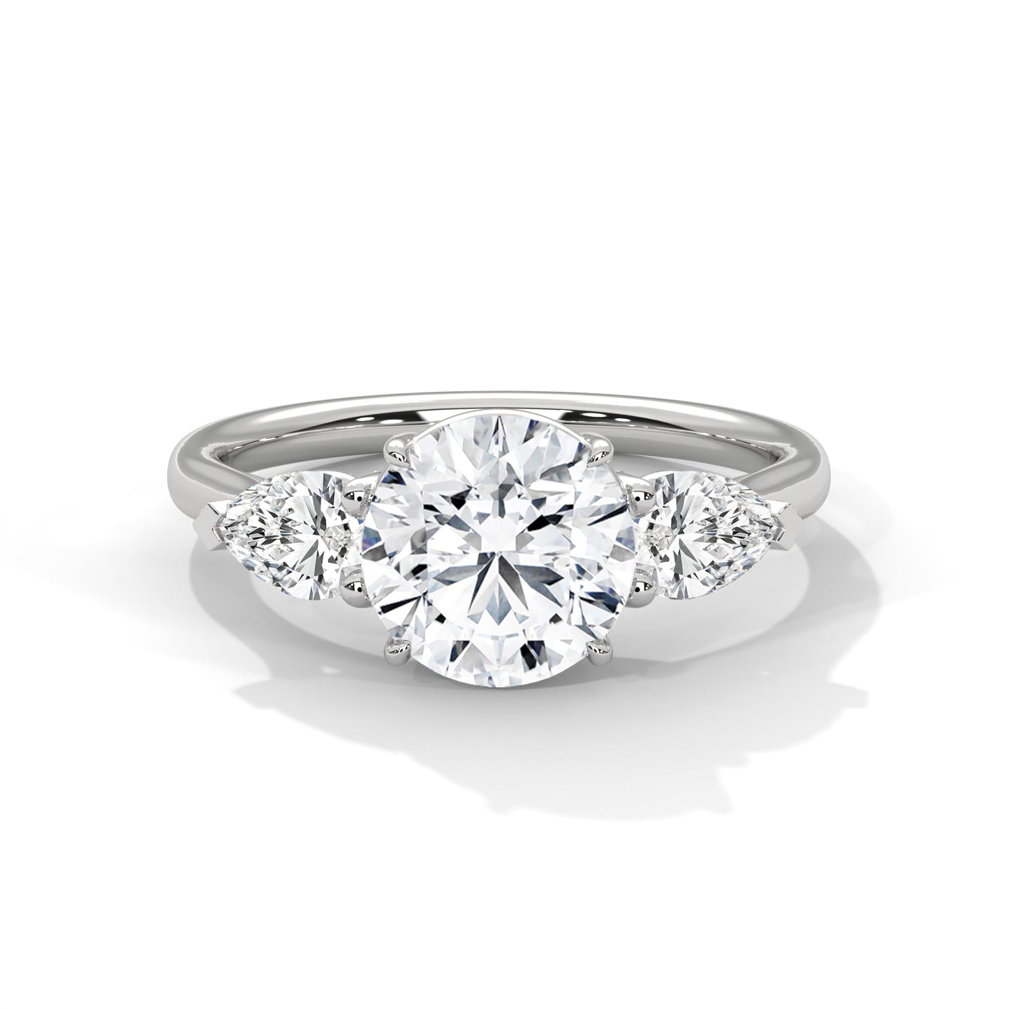 ROUND DIAMOND WITH PEAR SIDE STONE RING