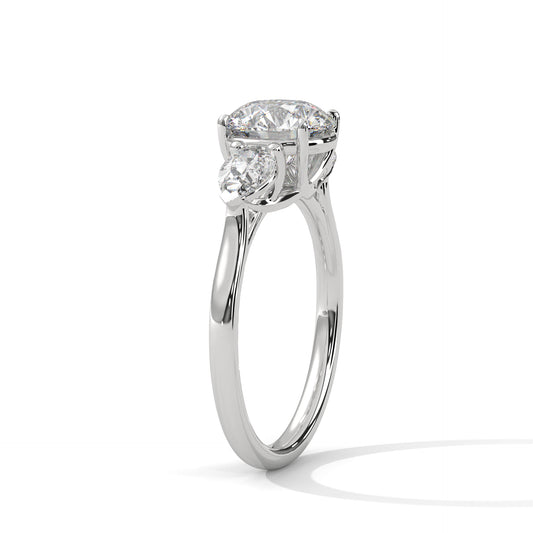ROUND DIAMOND WITH PEAR SIDE STONE RING