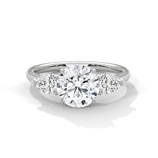 ROUND DIAMOND WITH PEAR SIDE STONE RING