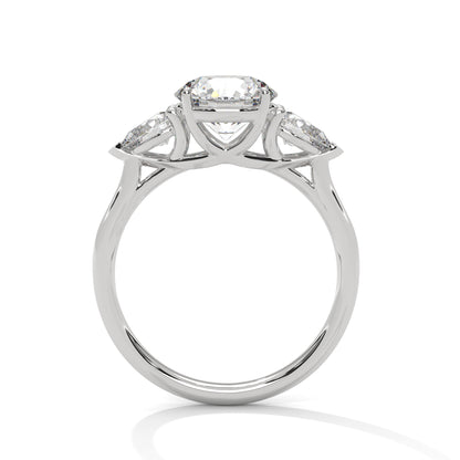 ROUND DIAMOND WITH PEAR SIDE STONE RING